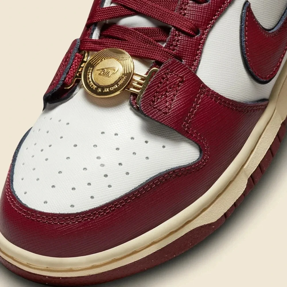 Nike Women's Sneakers in White and Burgundy with Gold Accents